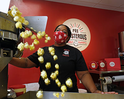 business owner cooking up popcorn